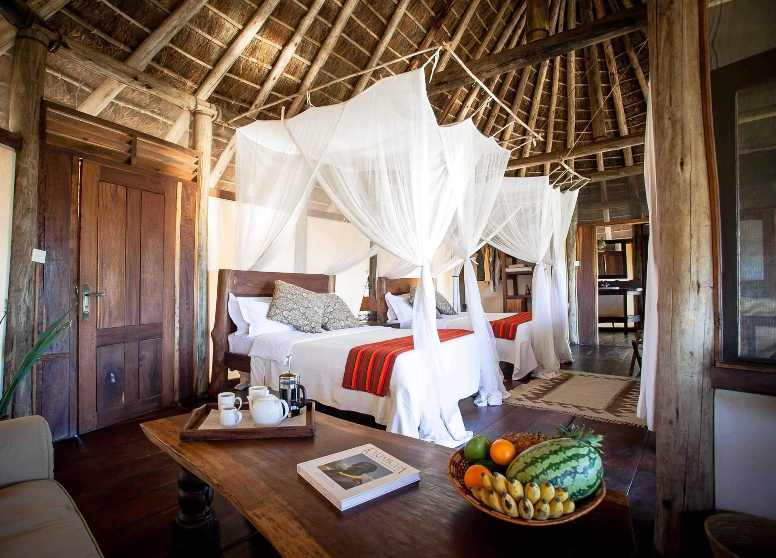 Spacious twin chalet with mosquito nets at Apoka Safari Lodge