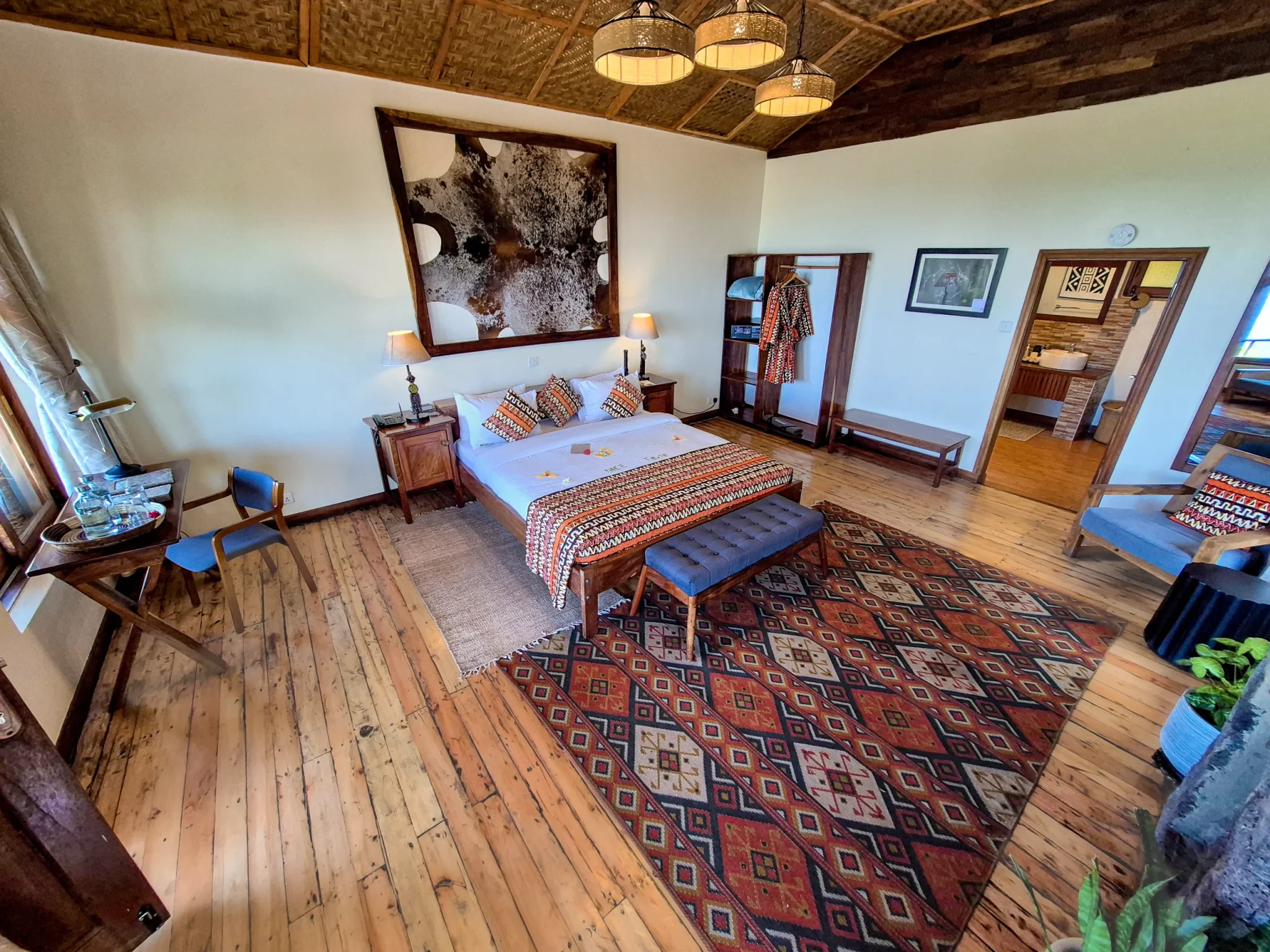 Nkuringo Gorilla Lodge deluxe room with warm wood interiors