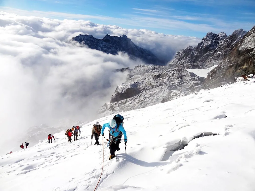 Climbers ascending Margherita Glacier in the Rwenzori Mountains